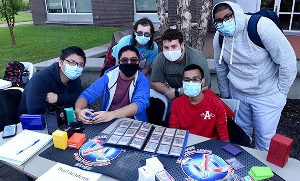 group of masked students at club fair