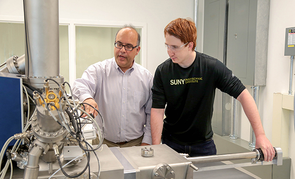 Professor Efstathiadis with a student in his lab