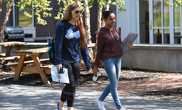 two female students walking on campus