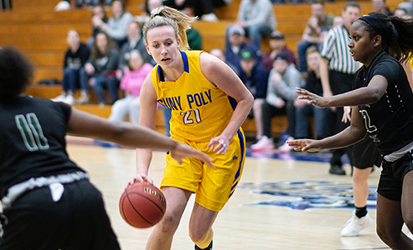 SUNY Poly female student playing in a basketball game