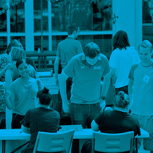 students at a club fair with transparent blue overlay