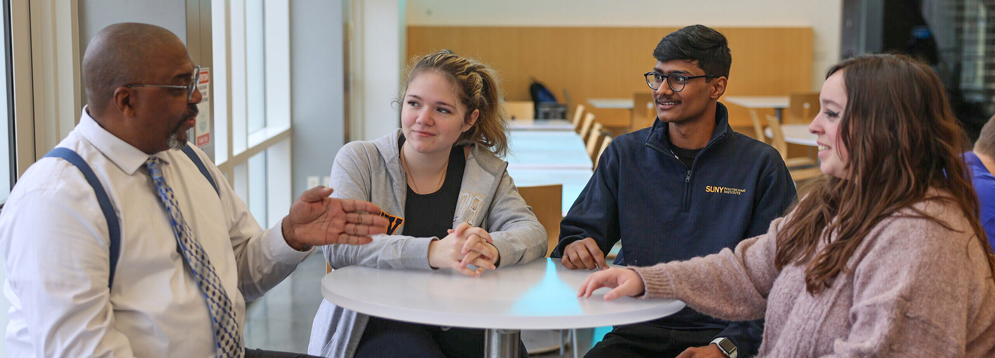 three friends chatting at a table