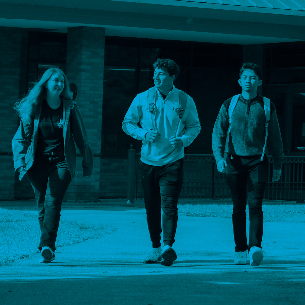 Three students walking with a transparent blue overlay